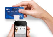 The Square card reader attaches to an iPhone or iPad.