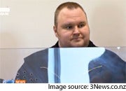 Kim Dotcom stands before a New Zealand court facing on Friday. Image is from a screen capture of 3News.co.nz