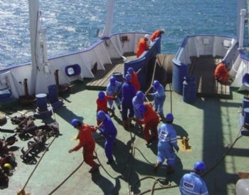 The crew of the vessel 'Pacific Guardian' recovers a cable for repair to restore telecom links across the Atlantic. Credit: Global Marine Systems