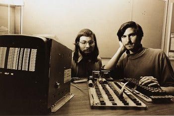 Steve Jobs, right, and Steve Wozniak in 1976 with the first Apple computer.
